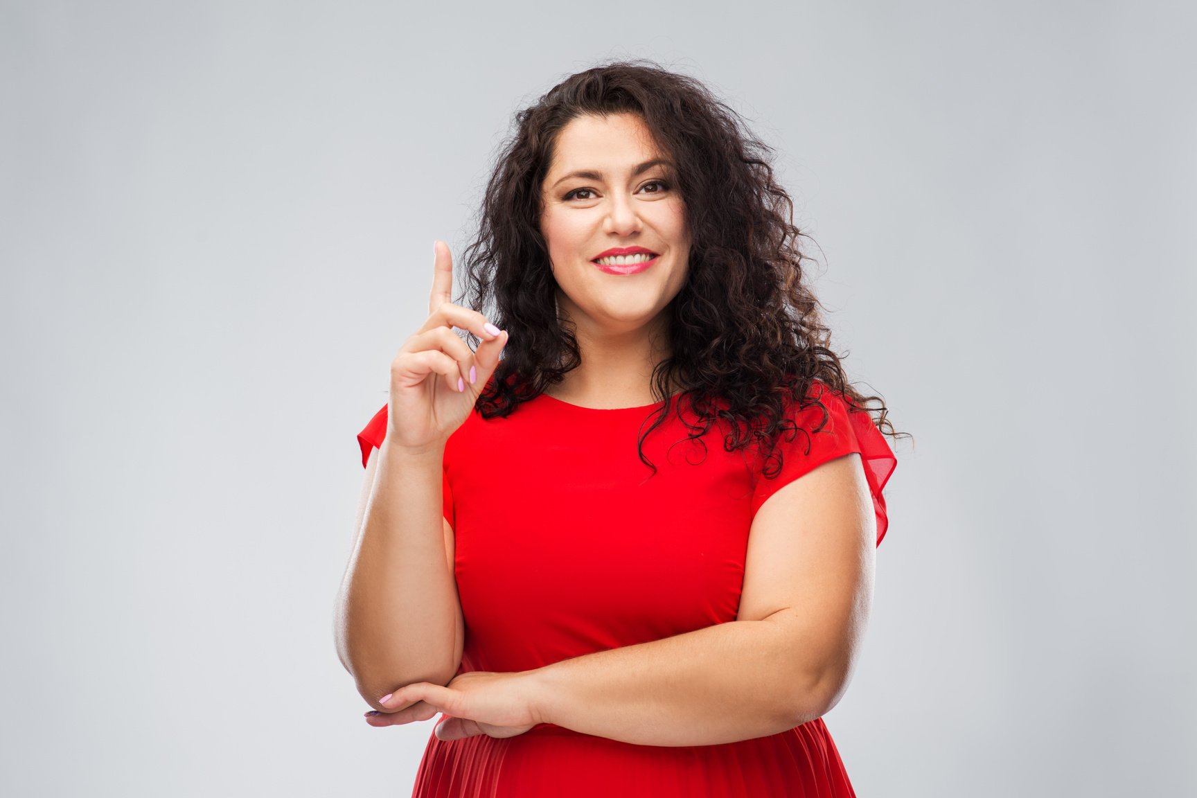 Woman in Red Dress Pointing Finger up